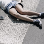 High Angle On Pedestrian Crossing And Smartphone Next To Victim